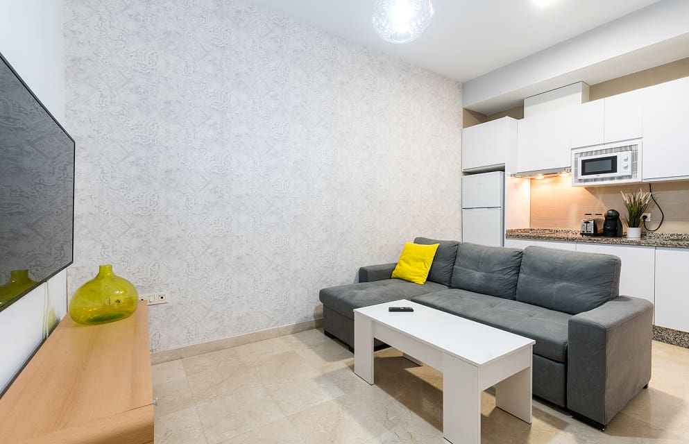 Fully equipped kitchen opening onto the living room at Hoteles del Sur